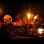 A Necromantic Ritual Altar with skulls, candles and magical grimoires