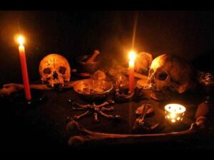 A Necromantic Ritual Altar with skulls, candles and magical grimoires